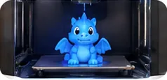3D-принтер друкує дракончика